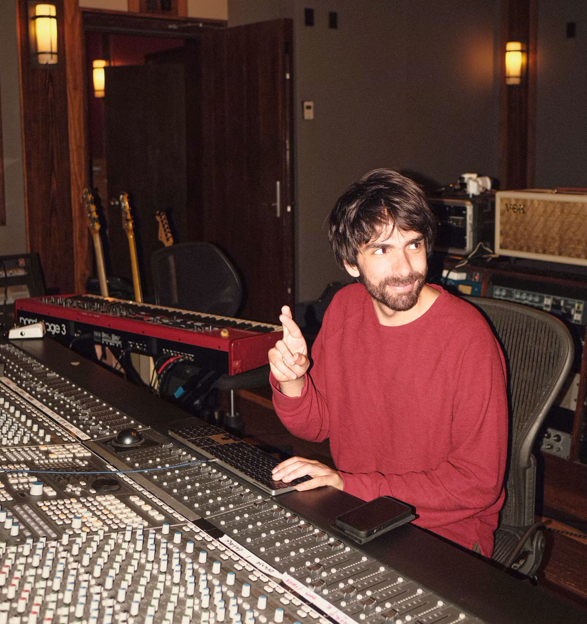 Oliver crossing his fingers in the studio